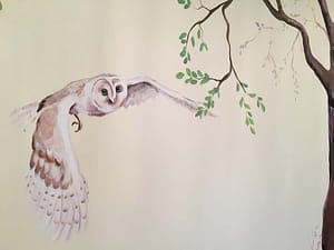 Owl flying in a woodland mural
